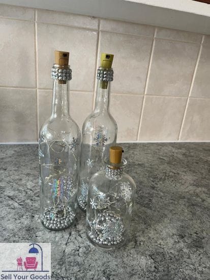 Three glass decor bottles with beads