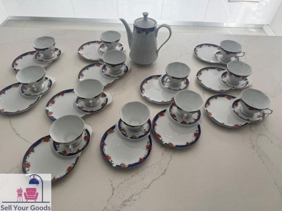Tea pot with cup and cake plate in one