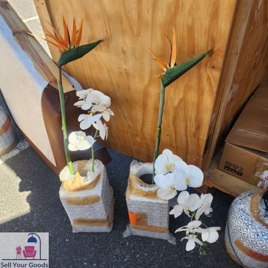 Two matching ceramic vases with artificial flowers