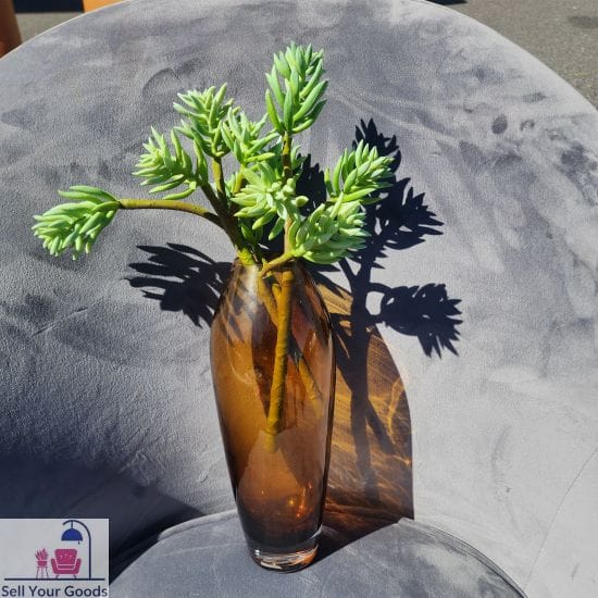 Amber vase with artificial succulent