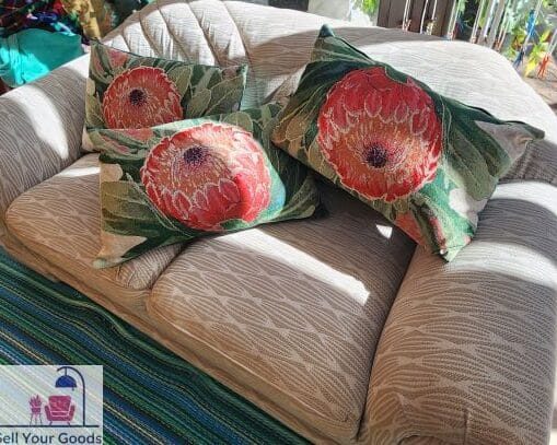 Three protea cushions