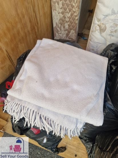 Beige tassled throw