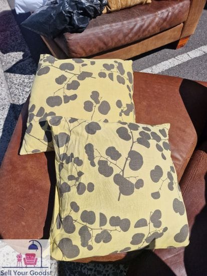 Two feather custard colour pillows with leafy pattern