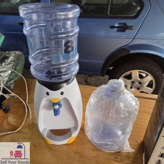 Penguin water dispenser with extra bottle