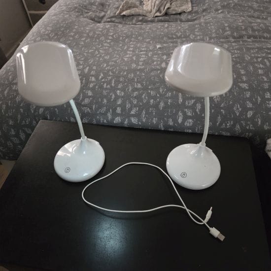 Two white portable lamps