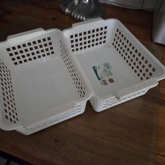 Two small white baskets
