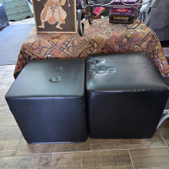 Two black ottomans